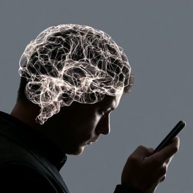 this shows a person looking at a phone and a brain.