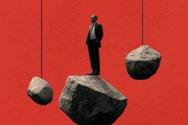 This shows a person standing on a rock.