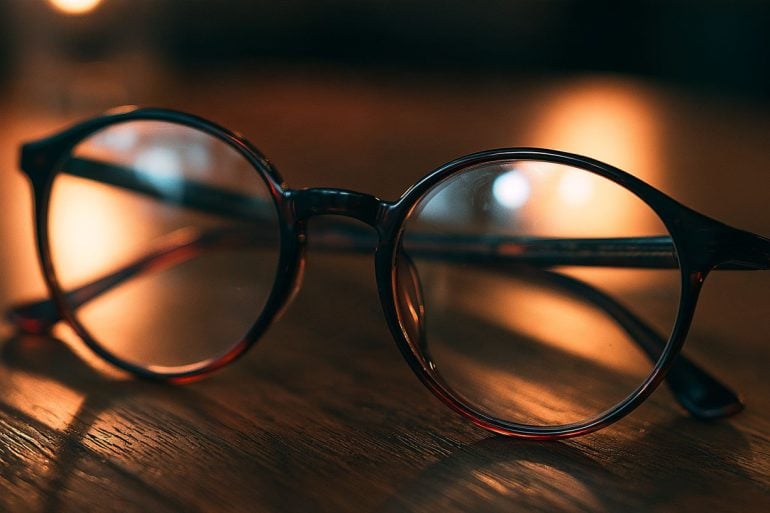 This shows a pair of glasses on a table.