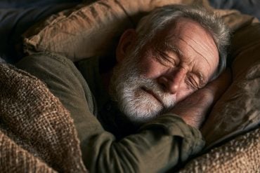 This shows an older man taking a nap.