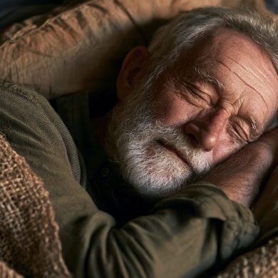This shows an older man taking a nap.