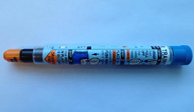An autoinjector is shown. It looks like a wide pen.